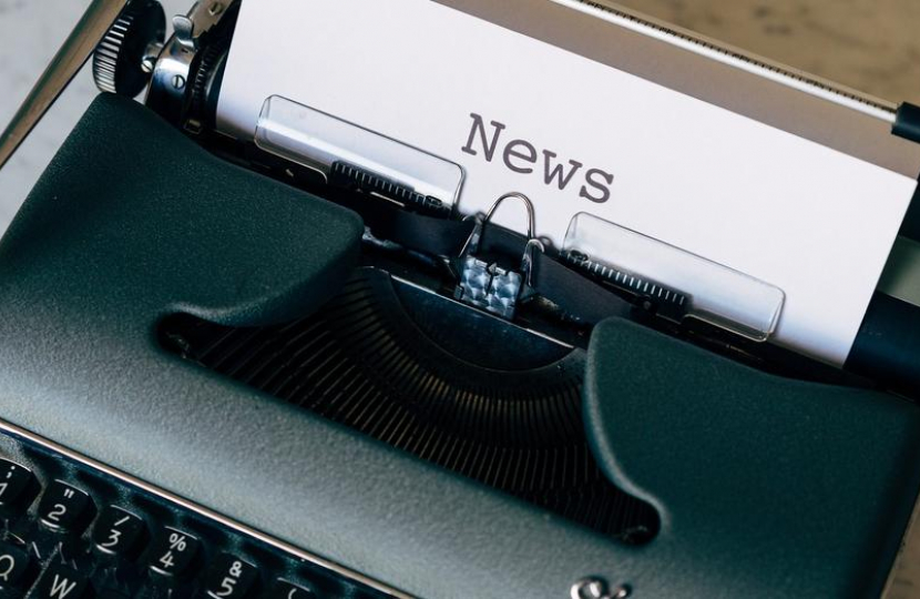 A typewriter typing a newsletter